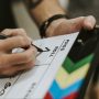 Behind the scenes with a clapper board